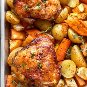 Baked chicken over potatoes